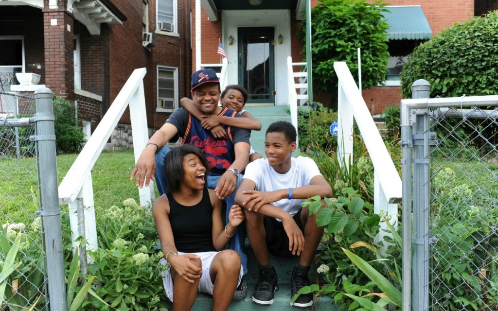 Derek, a single parent pictured here with his three children, works in security for the transit system in St. Louis. Despite working full-time, Derek has faced considerable challenges in providing food for his family and affording their other living expenses, often making tradeoffs to ensure his children have enough to eat. By visiting a local pantry for support during difficult financial times, Derek is able to supplement his limited income. Photo courtesy of Feeding America.
