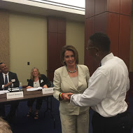 House Democratic Leader Nancy Pelosi greets LaJuana Clark. Formerly homeless, Clark still struggles to make ends meet.